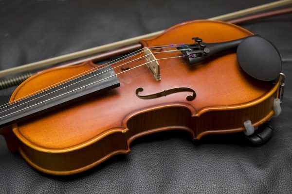 Close up photograph showing the detail of a violin.