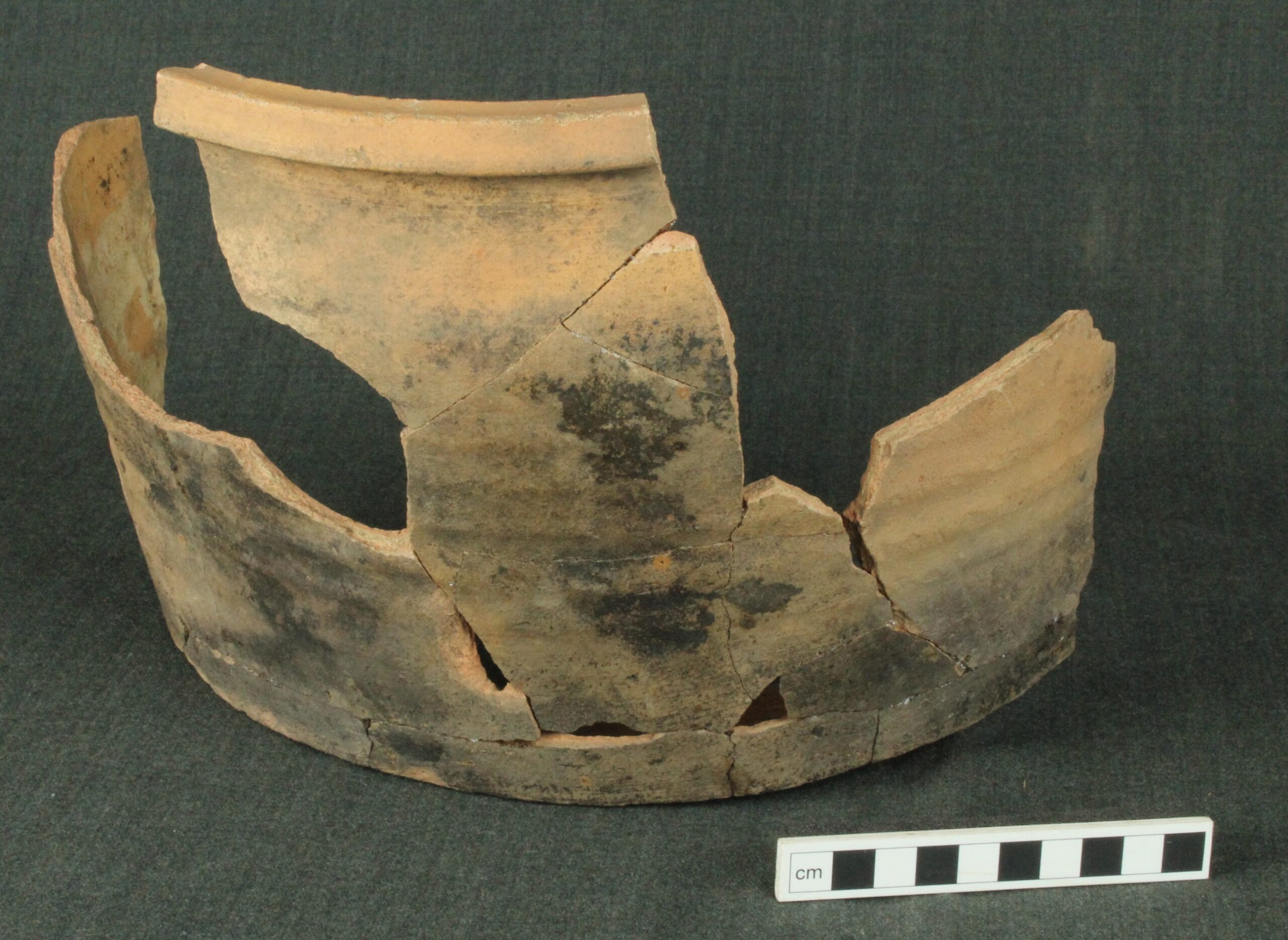 Sherds of a large pot, rejoined to show the original form