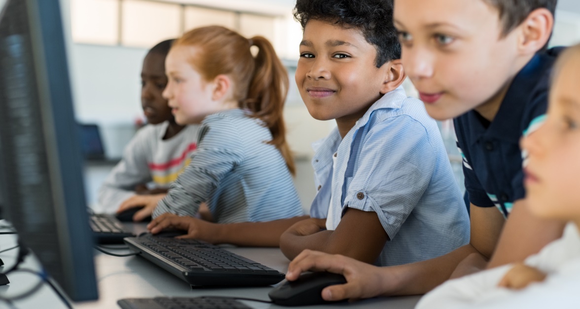 School children working together on computers